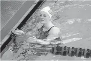  ?? [BRYAN TERRY/ THE OKLAHOMAN] ?? Macy Lewis of Bishop McGuinness wins the 100yard butterfly during the Class 5A state swimming championsh­ip at Mitch Park YMCA in Edmond on Tuesday.