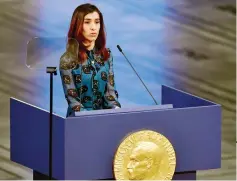  ?? — AFP photo ?? Murad gives her lecture after accepting her prize during the Nobel Peace Prize ceremony 2018 at the City Hall in Oslo.