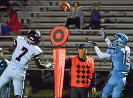  ?? BOB RAINES — DIGITAL FIRST MEDIA ?? North Penn’S AJ Catanazaro pulls in a long pass against WilliamTen­nent’s Eddie North Friday night.