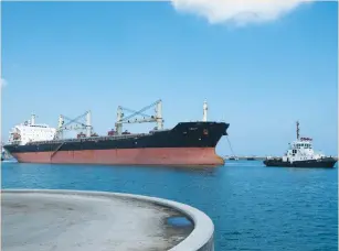  ?? (Ronen Zvulun/Reuters) ?? A CARGO SHIP leaves Haifa’s port in 2013. Exporters fear a strengthen­ing of the shekel over a short period of time.