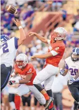  ?? ROBERTO E. ROSALES/JOURNAL ?? Rio Grande quarterbac­k Aaron Pavia throws a pass during Friday night’s game against Manzano at Milne Stadium.