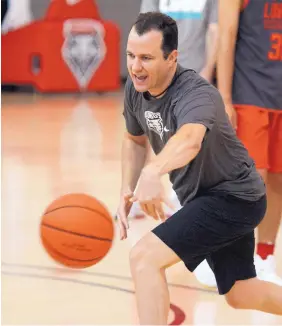  ?? GREG SORBER/JOURNAL ?? UNM Lobos basketball coach Paul Weir leads drills at a summer practice July 19 in the Rudy Davalos Center. He plans to have his team use full-court pressure all season.