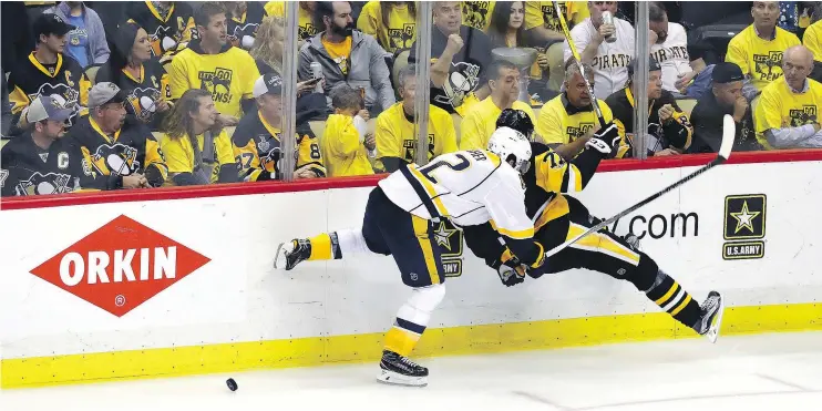  ?? — GETTY IMAGES ?? Nashville Predators captain Mike Fisher checks Evgeni Malkin of the Pittsburgh Penguins during action in the Stanley Cup Final. It’s Fisher’s second time in a final.