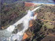  ?? WILLIAM CROYLE VIA REUTERS ?? A damaged spillway with eroded hillside is seen in an aerial photo taken over the Oroville Dam in California on Saturday.