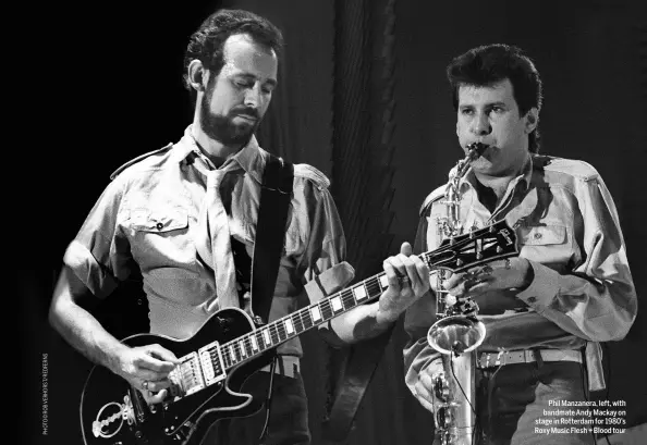  ??  ?? Phil Manzanera, left, with bandmate Andy Mackay on stage in Rotterdam for 1980’s Roxy Music Flesh + Blood tour