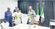  ?? ?? Nigeria Wrestling Federation president, Daniel Igali presenting a jersey to the Comptrolle­r General of Customs (CGC), Adewale Bashiru Adeniyi