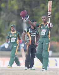  ??  ?? Windward Islands Volcanoes batsman Tyrone Theophile (right) celebrates his century while his teammate Kavern Hodge (left) looks on. At centre is Guyana Jaguars bowler Chandrapau­l Hemraj.