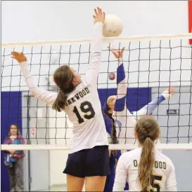  ??  ?? Mary Ownby looks on as Oakwood Christian's Annika Green (19) blocks a shot during a match against Rhea County Academy last week in Chickamaug­a. (Messenger photo/Scott Herpst)