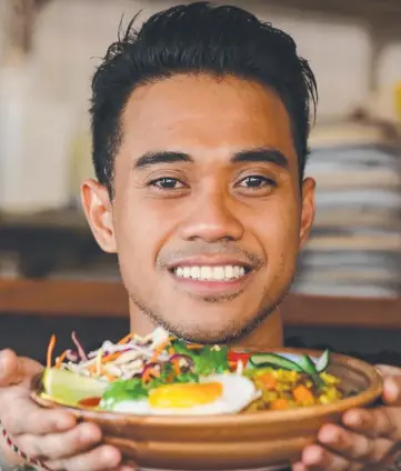  ?? Picture: GLENN CAMPBELL ?? Laneway Chef Dika Krishna with his Laksa flavoured Rice Bowl