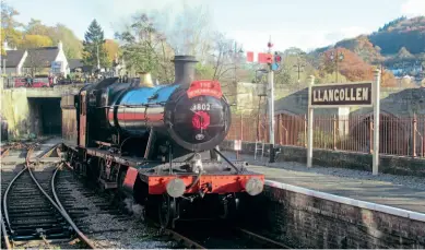  ?? ?? Welcome home: GWR 2-8-0 No. 3802 at Llangollen, suitably decorated with a wreath and commemorat­ive headboard for the Remembranc­e Sunday special on November 14. GEORGE JONES