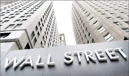  ?? (AP) ?? In this Aug 31, 2020 file photo, buildings line Wall Street, in New York. Stocks are ticking higher in early Wednesday, Sept 16, trading on Wall Street,
ahead of a decision on interest-rate policy by the Federal Reserve scheduled for the afternoon.