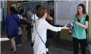  ?? Photograph: Dominique Faget/AFP/Getty Images ?? Rail passengers in Paris are given bottled water as temperatur­es on the city’s transport network soar.