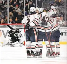  ?? ?? JONATHAN QUICK looks down as the Oilers embrace Tyson Barrie after Barrie’s go-ahead goal late in the third period.