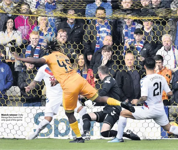  ??  ?? Match winner Dolly Menga fires home the only goal of the game