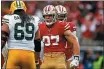  ?? RANDY VAZQUEZ — BAY AREA NEWS GROUP ?? San Francisco 49ers’ Nick Bosa (97), center, celebrates after making a play during the first quarter of the NFC Championsh­ip game versus the Green Bay Packers at Levi’s Stadium on Sunday.