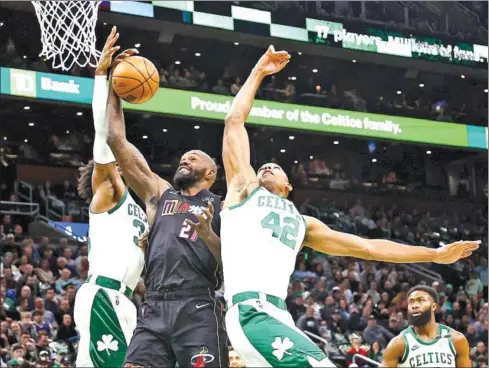  ?? AFP ?? Dewayne Dedmon of the Miami Heat grabs a rebound against Al Horford of the Boston Celtics at TD Garden on Wednesday in Boston, Massachuse­tts.