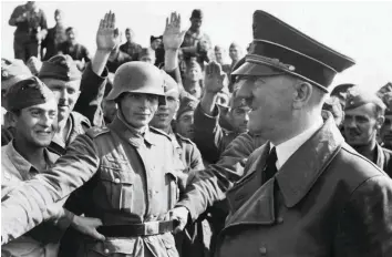  ??  ?? Hypnotic leader Hitler visits Wehrmacht soldiers in 1941. The second instalment of Frank McDonough’s history of the Third Reich lasers in on Hitler, who commanded the support of the majority of Germans until the end