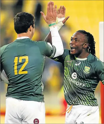  ?? Picture: GETTY IMAGES ?? HIGH FIVE: Seabelo Senatla celebrates with teammate Ruhan Nel after the Blitzboks beat Fiji in the New Zealand leg of the World Sevens Series at the Westpac Stadium in Wellington