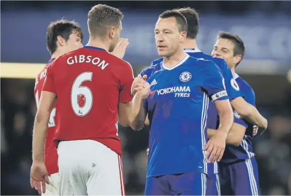  ??  ?? Ben Gibson is consoled by Chelsea’s John Terry after the defeat that confirmed relegation.