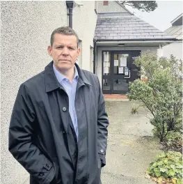  ??  ?? ● Rhun ap Iorwerth AM outside Longford House Surgery in Holyhead