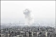  ?? HASSAN AMMAR / AP ?? Smoke rises following a Syrian government air strike on rebel positions in eastern Aleppo, Syria, Monday. The government seized large swaths of the Aleppo enclave under rebel control since 2012 in the offensive.