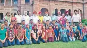  ??  ?? Khalsa University officials with players of the Hockey Academy at the appointmen­t of Baldev Singh as chief coach