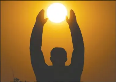  ?? (AP/Dmitri Lovetsky) ?? The sun sets over a statue of Gagarin at the Baikonur cosmodrome in Kazakhstan.