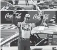  ?? PATRICK SMITH/ GETTY IMAGES ?? Denny Hamlin celebrates after winning Sunday’s NASCAR Cup Series Pocono 350.