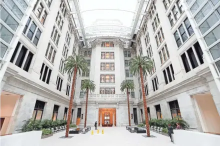  ??  ?? An atrium built around and connected to the original Northweste­rn Mutual building features real palm trees that have been preserved in the Northweste­rn Mutual Life Insurance Co. Tower and Commons skyscraper in Milwaukee.