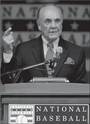  ?? The Associated Press ?? ENBERG: Dick Enberg speaks after receiving the Ford C. Frick Award during a ceremony on July 25, 2015, at Doubleday Field in Cooperstow­n, N.Y. Enberg, the sportscast­er who got his big break with UCLA basketball and went on to call Super Bowls,...