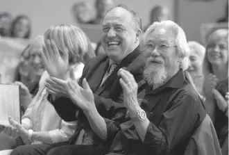  ??  ?? B.C. Green Leader Andrew Weaver, centre, is joined by several candidates and environmen­tal activist David Suzuki during a rally at the Victoria Conference Centre on Wednesday.