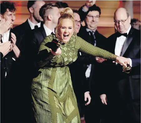  ??  ?? Adele accepts the award for album of the year for 25 at the 59th annual Grammy Awards on Sunday in Los Angeles.