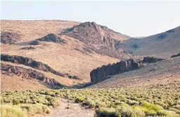  ?? JASON BEAN/THE RENO GAZETTE-JOURNAL ?? Montana Mountains loom over Thacker Pass in Nevada. Tribal lawyers have asked a judge to reconsider and block digging at a proposed mine.