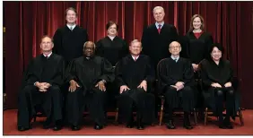 ?? (The New York Times/Erin Schaff) ?? Supreme Court justices pose for a group photo at the Supreme Court in Washington in April. Seated (from left) are Associate Justice Samuel Alito, Associate Justice Clarence Thomas, Chief Justice John Roberts, Associate Justice Stephen Breyer and Associate Justice Sonia Sotomayor, Standing (from left) are Associate Justice Brett Kavanaugh, Associate Justice Elena Kagan, Associate Justice Neil Gorsuch and Associate Justice Amy Coney Barrett.