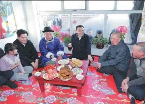  ?? YAO DAWEI / XINHUA ?? Premier Li Keqiang visits a poverty-stricken family in the village of Shierzhou on Saturday during a two-day inspection tour to Ulaanqab city in the Inner Mongolia autonomous region starting Friday.