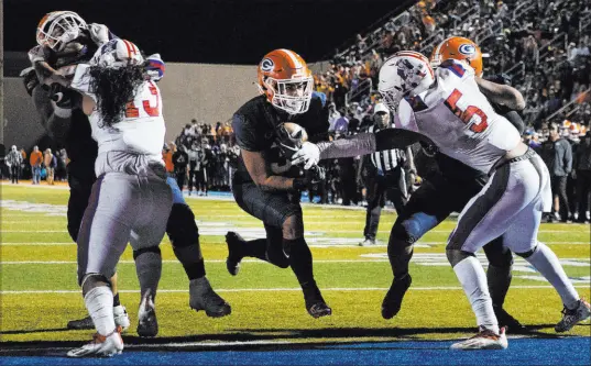  ?? Bizuayehu Tesfaye Las Vegas Review-journal @bizutesfay­e ?? Bishop Gorman running back Cam’ron Barfield runs for a touchdown during the second half of Friday’s Class 5A Southern Region championsh­ip against Liberty at Bishop Gorman. Gorman won 35-14.