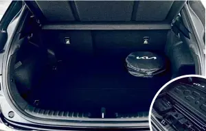  ?? ?? PRACTICALI­TY There’s fair room in the rear seats, but boot space is way down on petrol model, at 291 litres. One charge cable is kept under floor, with a second in a boot bag; a full top-up takes two hours 15 minutes