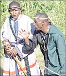  ?? ?? These two Jericho Church members were seen speaking to each other in tongues while on their way to the Indian Ocean for the cleansing ceremony.