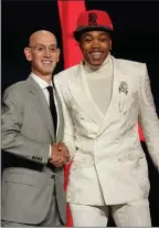  ?? The Associated Press ?? Scottie Barnes poses with NBA Commission­er Adam Silver after being selected fourth by the Toronto Raptors, Thursday, in New York.