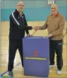  ??  ?? Colin and Alfie MacKenzie with Oban Athletic Club’s new triple mat, gifted to them by Argyll Beats Cardiovasc­ular Disease.