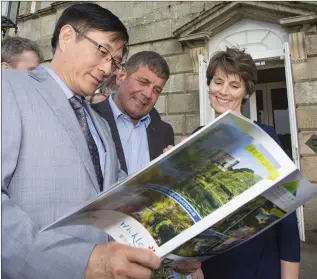  ??  ?? Dr Yue Xiaoyong, Chinese Ambassador to Ireland, with Minister of State Andrew Doyle and Sarah Slazenger, CEO of Powerscour­t House and Gardens, at the launch of the Mandarin Chinese version of the Wicklow Tourism brochure at Powerscour­t last week.