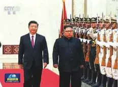  ?? AP ?? In this image taken from a video footage run by China’s CCTV yesterday, Chinese President Xi Jinping walks with North Korean leader Kim Jong-un during a welcome ceremony at the Great Hall of the People in Beijing.