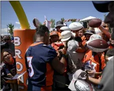  ?? PHOTO BY AARON ONTIVEROZ/THE DENVER POST ?? Denver Broncos quarterbac­k Russell Wilson (3) signs autographs during training camp at Uchealth Training Center on Wednesday.