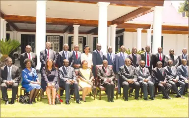  ??  ?? President Emmerson Mnangagwa and First Lady Auxillia Mnangagwa pose for a group photograph with newly-appointed ministers at a swearing-in ceremony at State House in Harare yesterday. — (See more pictures on Page 4 and www.herald. co.zw)