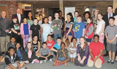  ??  ?? Above, state Sen. Marc Cote, back left, along with state Reps. Stephen Casey and Michael Morin, from left, joined fifth-grade classes from Globe Park Elementary School on Wednesday morning as they arrived for their tour of Woonsocket’s Museum of Work...