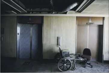  ?? Photograph­s by Luis Sinco Los Angeles Times ?? AN ABANDONED wheelchair inside L.A. County General Hospital. As early as the 1960s, the facility — lacking air conditioni­ng and fire sprinklers — was straining to keep pace with the demands of new technology.