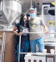  ?? RHYTHM BREWING/COURTESY ?? Alisa Bowens-Mercado of Rhythm Brewing, Connecticu­t’s only Black female brewery owner, with Phil Markowski of Two Roads Brewing.