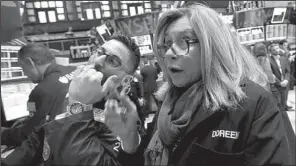  ?? AP/RICHARD DREW ?? Specialist Christian Sanfilippo (left) and trader Doreen Mogavero work Wednesday on the floor of the New York Stock Exchange.