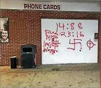  ?? SUBMITTED PHOTO ?? Racial graffiti mars the garage door of a home in Coatesvill­e.