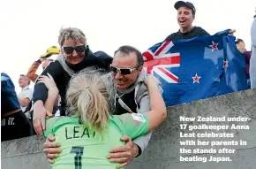 ??  ?? New Zealand under17 goalkeeper Anna Leat celebrates with her parents in the stands after beating Japan.